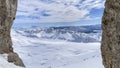 Winter views of the fascinating mountain range from the entrance of a cave in the peak mountains Royalty Free Stock Photo