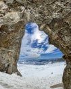 Winter views of the fascinating mountain range from the entrance of a cave in the peak mountains Royalty Free Stock Photo