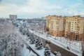 Winter Voronezh cityscape. Frozen trees in a forest covered by snow near modern houses in the city of Voronezh Royalty Free Stock Photo