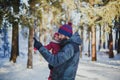 Winter walk with a child: dad and daughter walk in the winter forest 1 Royalty Free Stock Photo