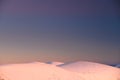 Winter wallpaper. Hills in sunrise light, white edit space