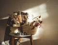 Winter warm blanket on a chair with a basket of Christmas decorations, books and led string lights. HOME. Winter reading. House Royalty Free Stock Photo