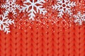 Winter warm red knitted background with realistic white snow and snowflakes. Vector Christmas and New Year illustration Royalty Free Stock Photo