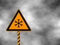 Winter warning yellow sign shows danger of ice and snow at street, highway or road. Snow warning sign Risk of Ice warning sign i Royalty Free Stock Photo