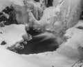 Winter waterfall base in black and white Royalty Free Stock Photo