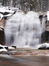 Winter Waterfall. Small Pond And Snowy Boulders Bellow Cascade Of Waterfall. Crystal Freeze Water Of Mountain River And Sounds Of