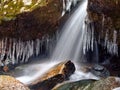 Winter waterfall thaw and icicles Royalty Free Stock Photo