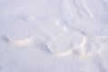 Winter wavy background of snowy surface. Natural snow texture. Horizontal format. Copy space. Royalty Free Stock Photo