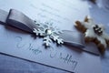 Winter Wedding text with ribbon and snowflake