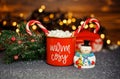 Winter whipped cream coffee in a red mug. Homemade sweet drink.