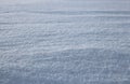 Winter white snow cover of sparkling snowflakes with shiny frozen ice on the surface