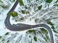 Winter winding road in the mountains with cars on the road Royalty Free Stock Photo