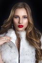 Winter Woman in Luxury Fur Coat. Beauty Fashion Model Girl in Bl Royalty Free Stock Photo