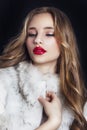 Winter Woman in Luxury Fur Coat. Beauty Fashion Model Girl in Bl Royalty Free Stock Photo