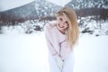 Winter woman in the snow. Beautiful girl in the winter in nature. Royalty Free Stock Photo