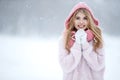 Winter woman in the snow. Beautiful girl in the winter in nature. Royalty Free Stock Photo