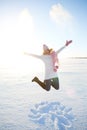 winter women jump in snow