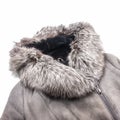 Winter women`s clothing. A fragment of a gray sheepskin coat