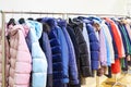 Winter women`s jackets on hanger in store Royalty Free Stock Photo