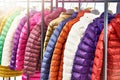 Winter women`s jackets on hanger in store Royalty Free Stock Photo