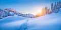 Winter wonderland in the Alps with mountain chalet at sunset Royalty Free Stock Photo