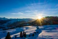 Winter wonderland in the Alps with mountain at sunset - Snow. Aerial view Royalty Free Stock Photo