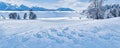 Winter wonderland and Christmas landscape. Frozen lake in snowy mountains and trees covered with snow as holiday Royalty Free Stock Photo