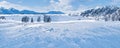 Winter wonderland and Christmas landscape. Frozen lake in snowy mountains and trees covered with snow as holiday Royalty Free Stock Photo