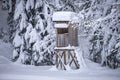 Winter wonderland with a raised hide at the forest Royalty Free Stock Photo