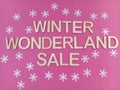 Winter wonderland sale sign on a pink background