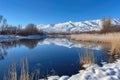 winter wonderland, with snow-covered mountain peaks and frozen lakes, against a blue sky Royalty Free Stock Photo