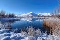 winter wonderland, with snow-covered mountain peaks and frozen lakes, against a blue sky Royalty Free Stock Photo