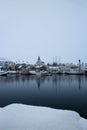 Winter wonderland snow landscape boat ship in harbour port of Husavik atlantic ocean sea Northern Iceland Europe