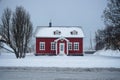 Winter wonderland snow panorama typical red house traditional building Formannshus in Husavik Northern Iceland Europe