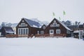 Winter wonderland snow panorama typical traditional wooden house building waterfront in Husavik Northern Iceland Europe
