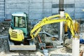 Winter work in construction site with excavator Royalty Free Stock Photo