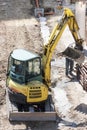 Winter work in construction site with excavator Royalty Free Stock Photo