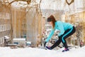 Winter workout. Girl wearing sportswear, stretching exercises Royalty Free Stock Photo