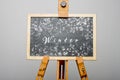 Winter written on black chalkboard with snowflakes around Royalty Free Stock Photo