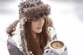 Winter young girl with cup of hot chocolate