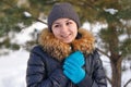 Winter young woman portrait. Beauty Joyful Model Girl laughing and having fun in winter park. Beautiful young female outdoors Royalty Free Stock Photo