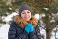 Winter young woman portrait. Beauty Joyful Model Girl laughing and having fun in winter park. Beautiful young female outdoors Royalty Free Stock Photo