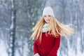 Winter young teen girl portrait. Beauty Joyful Model Girl laughing and having fun in winter park. Beautiful young woman
