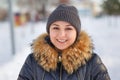 Winter young woman portrait. Beauty Joyful Model Girl laughing and having fun in winter park. Beautiful young female outdoors Royalty Free Stock Photo