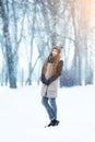 Winter young woman portrait. Beauty Joyful Model Girl laughing and having fun in winter park. Beautiful young woman