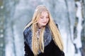 Winter young teen girl portrait. Beauty Joyful Model Girl laughing and having fun in winter park. Beautiful young woman