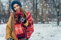 Winter young woman portrait. Beauty Joyful Model Girl laughing and having fun in winter park. Beautiful young female