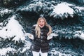 Winter young woman portrait. Beauty Joyful Model Girl laughing and having fun in winter park. Beautiful young woman Royalty Free Stock Photo