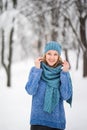 Winter young woman portrait. Beauty Joyful Model Girl laughing, having fun in winter park. Beautiful young woman laughing outdoors Royalty Free Stock Photo