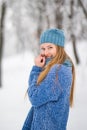 Winter young woman portrait. Beauty Joyful Model Girl laughing, having fun in winter park. Beautiful young woman laughing outdoors Royalty Free Stock Photo